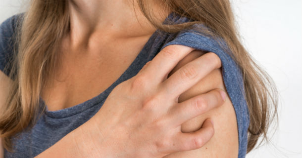 bigstock-Woman-With-Shoulder-Pain-Is-Ho-213381319